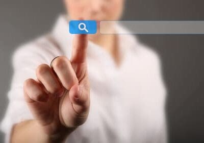 Person searching keywords on Google